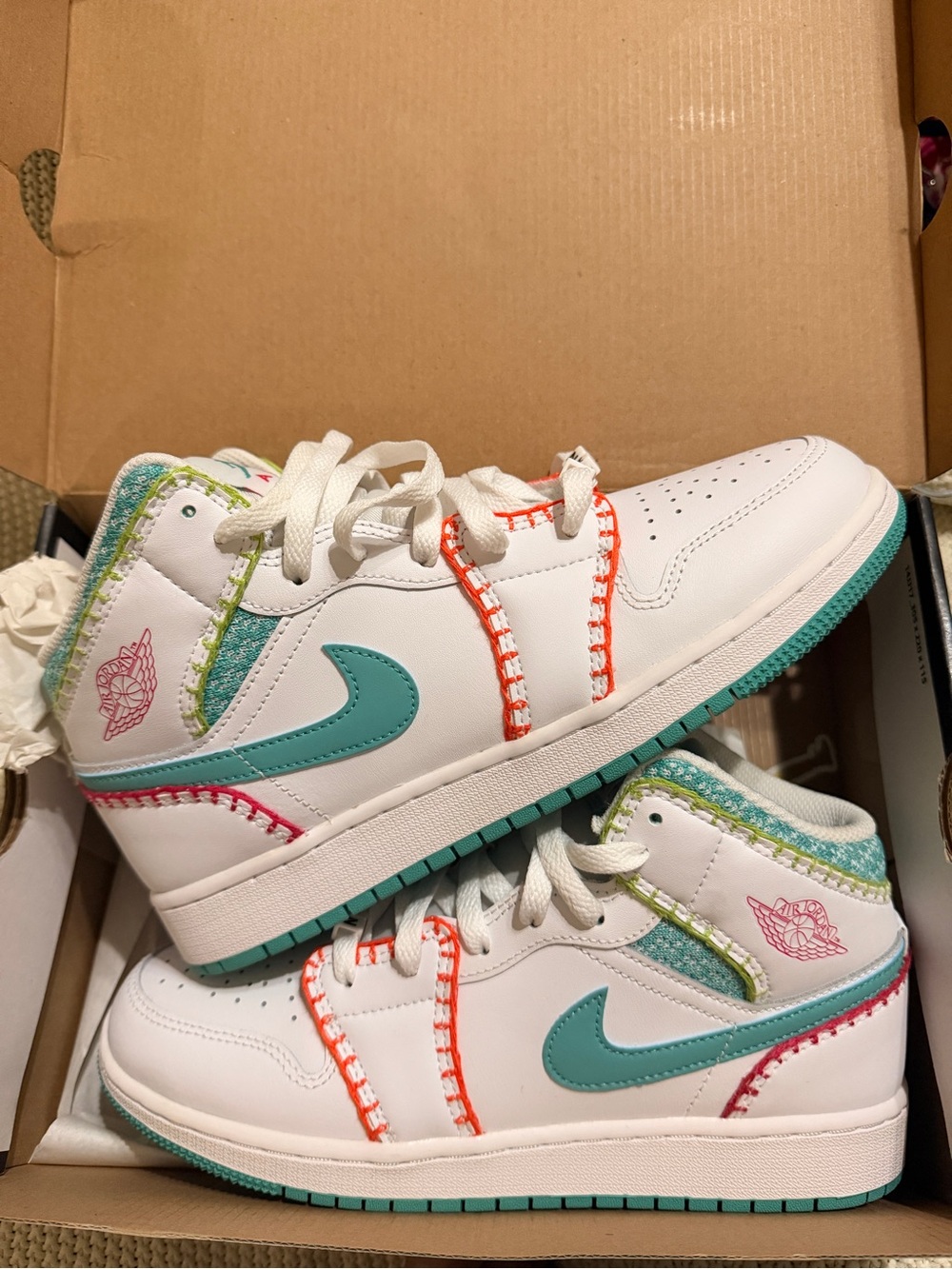 Nike Kids White Sneakers with Teal Swoosh and Coral Stitching